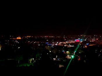 High angle view of illuminated buildings in city at night