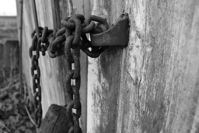 Close-up of door locked with metal chain