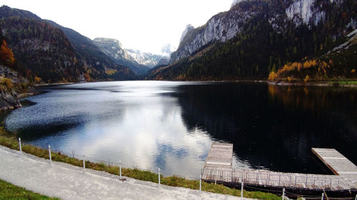 Scenic view of lake and mountains against sky