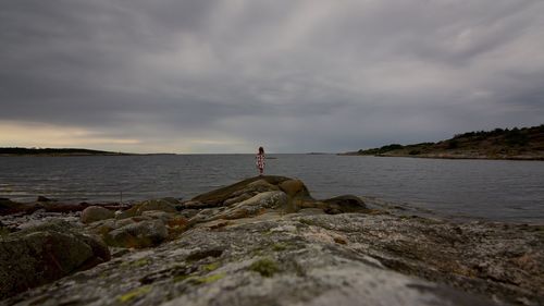 Scenic view of sea against cloudy sky