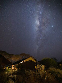 Scenic view of field against sky at night