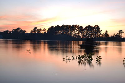 Scenic view of lake against sky during sunset