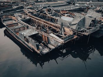 High angle view of fishing boats moored at harbor