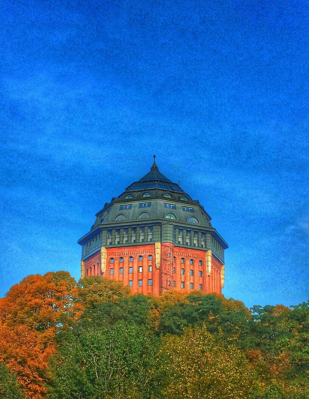 architecture, building exterior, built structure, place of worship, sky, religion, blue, low angle view, church, spirituality, tree, cloud - sky, plant, growth, outdoors, house, cloud, no people, nature