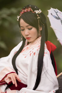 Portrait of young woman looking away