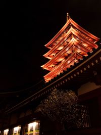 Low angle view of illuminated building at night