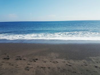 Scenic view of beach against clear sky