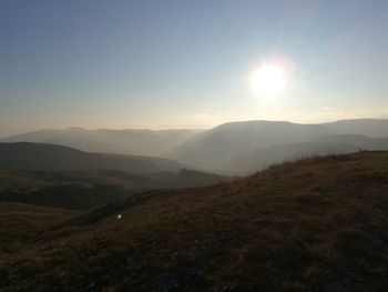 Scenic view of landscape against sky during sunset