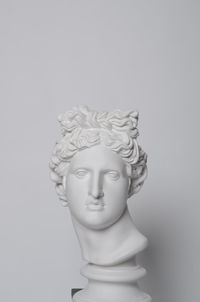 Close-up of statue against white background