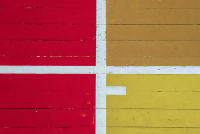 Full frame shot of red and yellow wooden wall