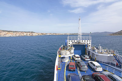 High angle view of ship moored at harbor against sky