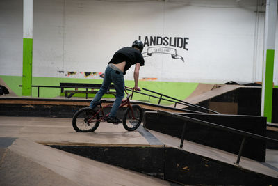 Side view of man riding bicycle