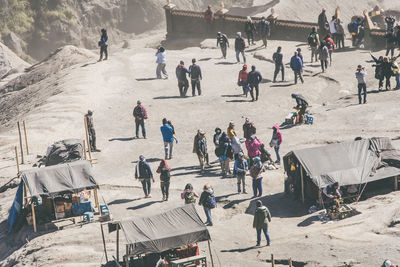 High angle view of hikers on volcanic land