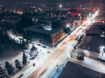 High angle view of city street and buildings at night