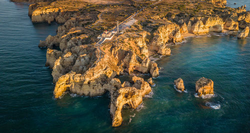 High angle view of rock formation in sea