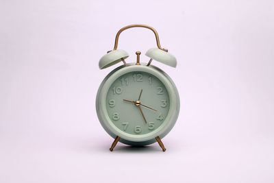 Close-up of clock on white background