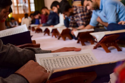 Young men reading koran in mosque