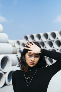 Portrait of young woman looking at camera