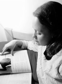 Portrait of woman reading book