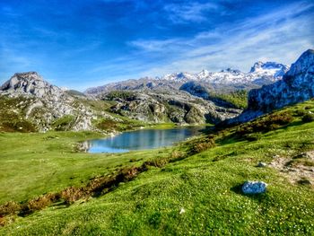 Scenic view of lake and mountains against sky