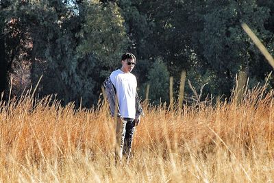 Young man standing on field