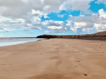 Scenic view of beach against sky