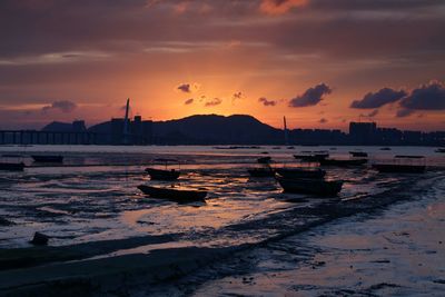 Boats moored in shallow water at the seaside