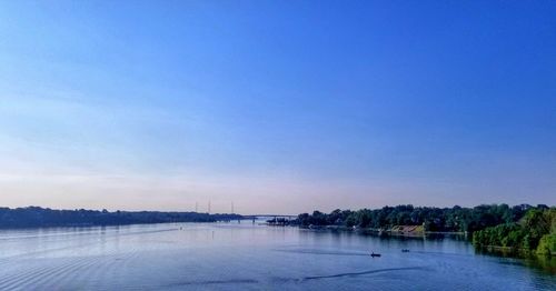 Scenic view of lake against blue sky