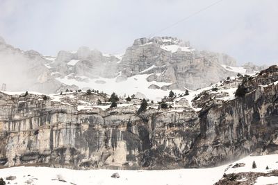 Scenic view of snow covered mountains