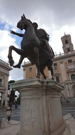 Low angle view of statue against sky
