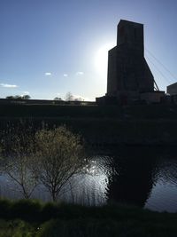 Built structure against blue sky and clouds