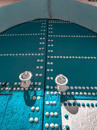 Blue and white ancient door in sunlight