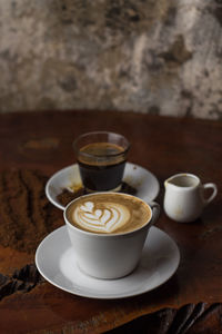 Close-up of coffee cup on table