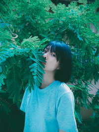 Portrait of woman with plants