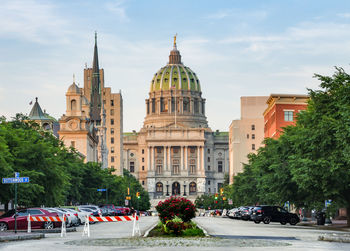 View of buildings in city against sky