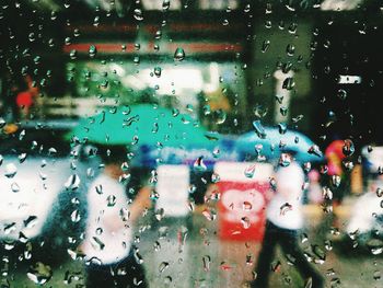 Full frame shot of wet glass window in rainy season