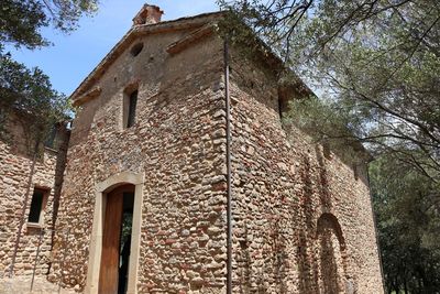 Low angle view of old building against sky