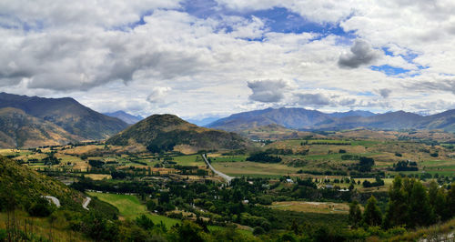 Scenic view of mountains against cloudy sky