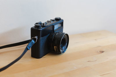 Close-up of camera on table