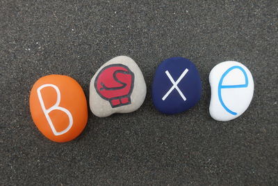 Colorful pebbles with text