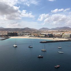 High angle view of sailboats in sea against sky