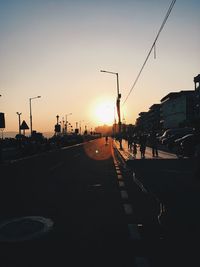 Silhouette city against clear sky during sunset