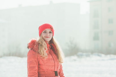 Portrait of beautiful woman in red hat