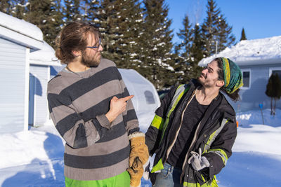 Friends on snow covered mountains