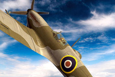 Low angle view of airplane against sky