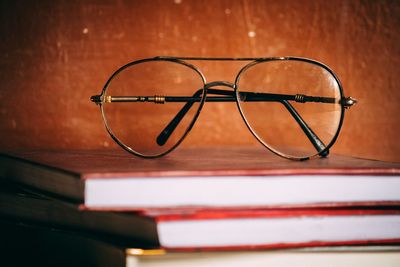 Close-up of eyeglasses on books