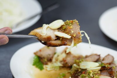 Close-up of hand holding food
