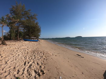 Scenic view of beach against clear sky