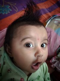 Close-up portrait of cute baby at home