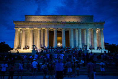 Group of people in front of historical building